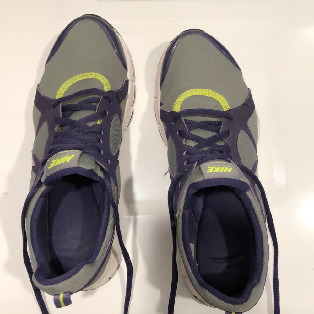 Gray and purple Nike tennis shoes